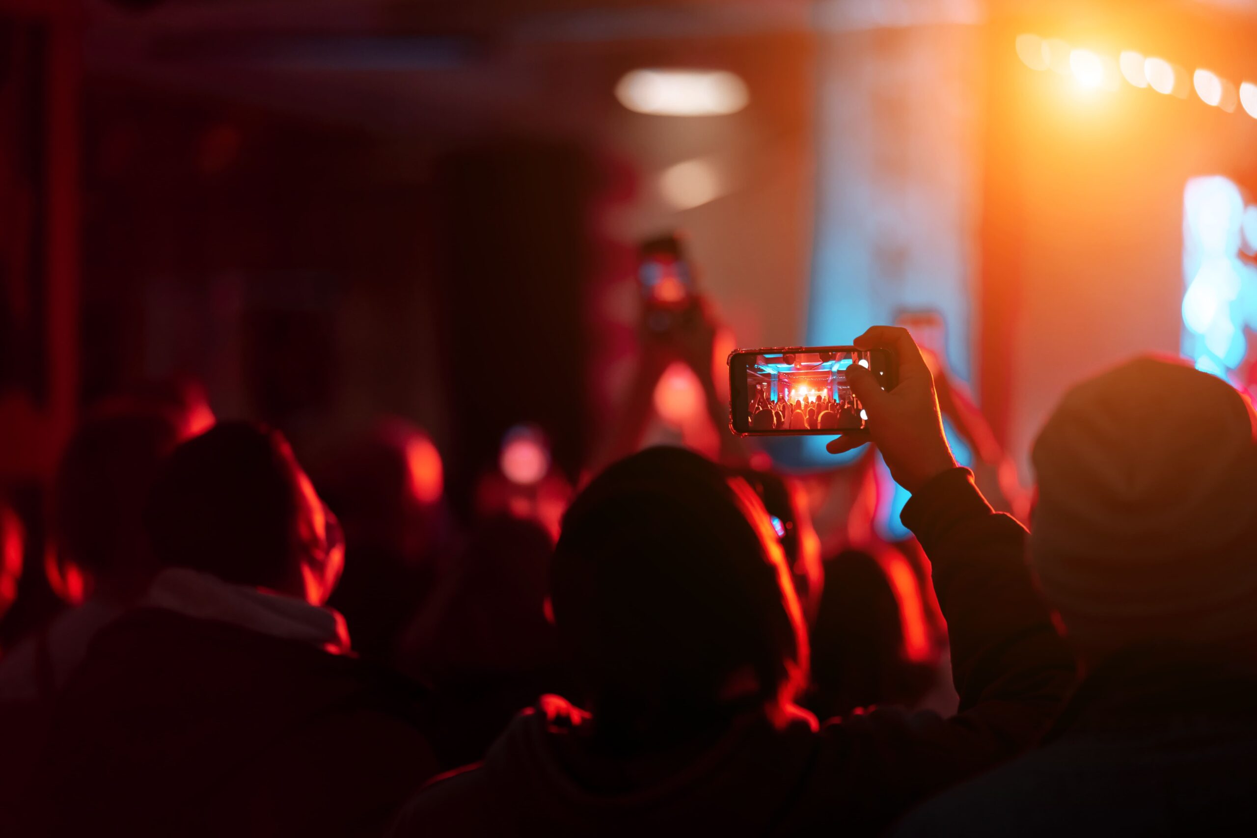 close-up-recording-video-with-smartphone-concert