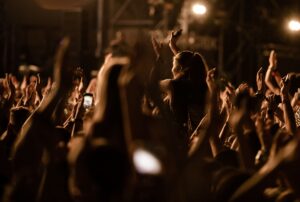 crowd-people-with-raised-arms-having-fun-music-festival-by-night